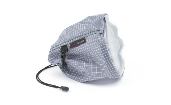 A medium, clear-bottom Yarn Stuff Sack in Northwest Sky (light grey with white grid) 200 Halcyon.